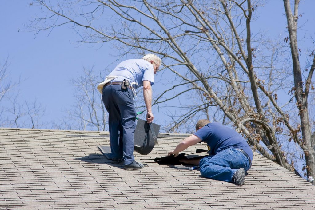 professional roofing contractor roofers doing roof repair